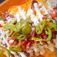 Nachos Agua Verde · Chips with monterey jack & cheddar cheese, pinto beans, jalapeños, scallions, sour cream & p...