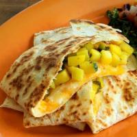 Mangodilla · Quesadilla with mango, poblano peppers, green onions. *contains gluten.