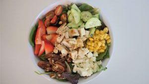 Strawberry Pecan · Grilled chicken, feta cheese, corn, cucumber, cherry tomatoes, strawberries, pecans and ranc...