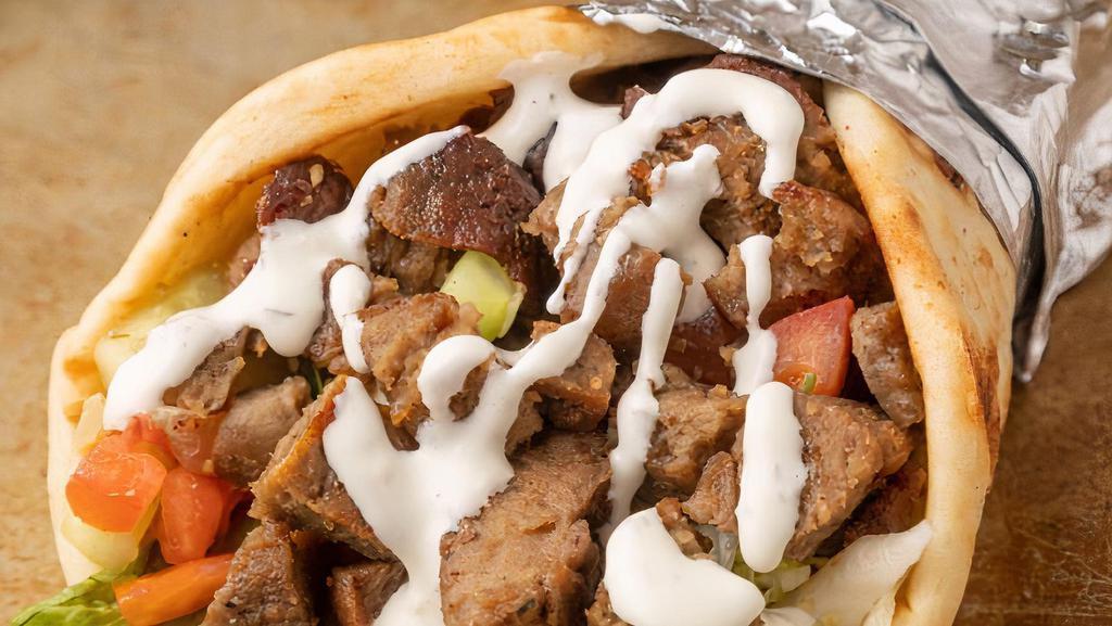Lamb Gyro · Doner style lamb served in hot pita bread. Served with Tomatoes, lettuce onions, green peppers and homemade sauce tzatziki, garlic and hot.