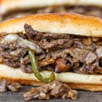Philly Cheesesteak · Thinly sliced pieces of ribeye steak and melted provolone cheese in a toasted pub roll. Serv...