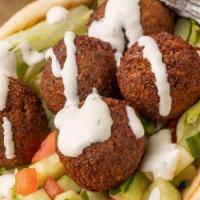 Falafel Gyro · Our falafel is made from scratch with garbanzo beans and spices served in hot pita bread. Se...