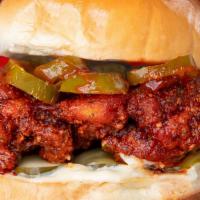 Hot Chxx · Fried Chxx Sandwich, hot oil blend, house spicy ketchup, mayo, pickles, jalapenos.