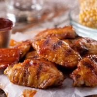 Bbq Wings · Tangy and sweet BBQ tossed chicken wings fried to perfection.