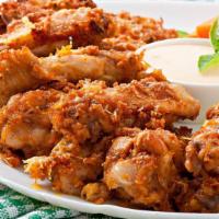 Spicy Garlic Wings · Popular and exquisite chicken wings tossed with spicy garlic sauce.