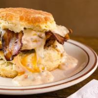 The Franklin · Buttermilk fried chicken, bacon + cheddar cheese smothered in housemade sausage or vegetaria...