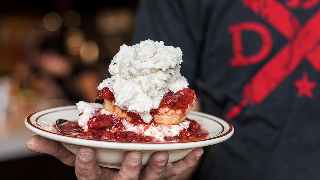 Strawberry Shortcake · Biscuit smothered with sweet strawberry sauce topped with whipped cream.
