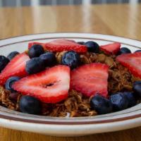 Granola Bowl · Oats, pecans, brown sugar, maple syrup and cinnamon on whipped yogurt + fresh berries.