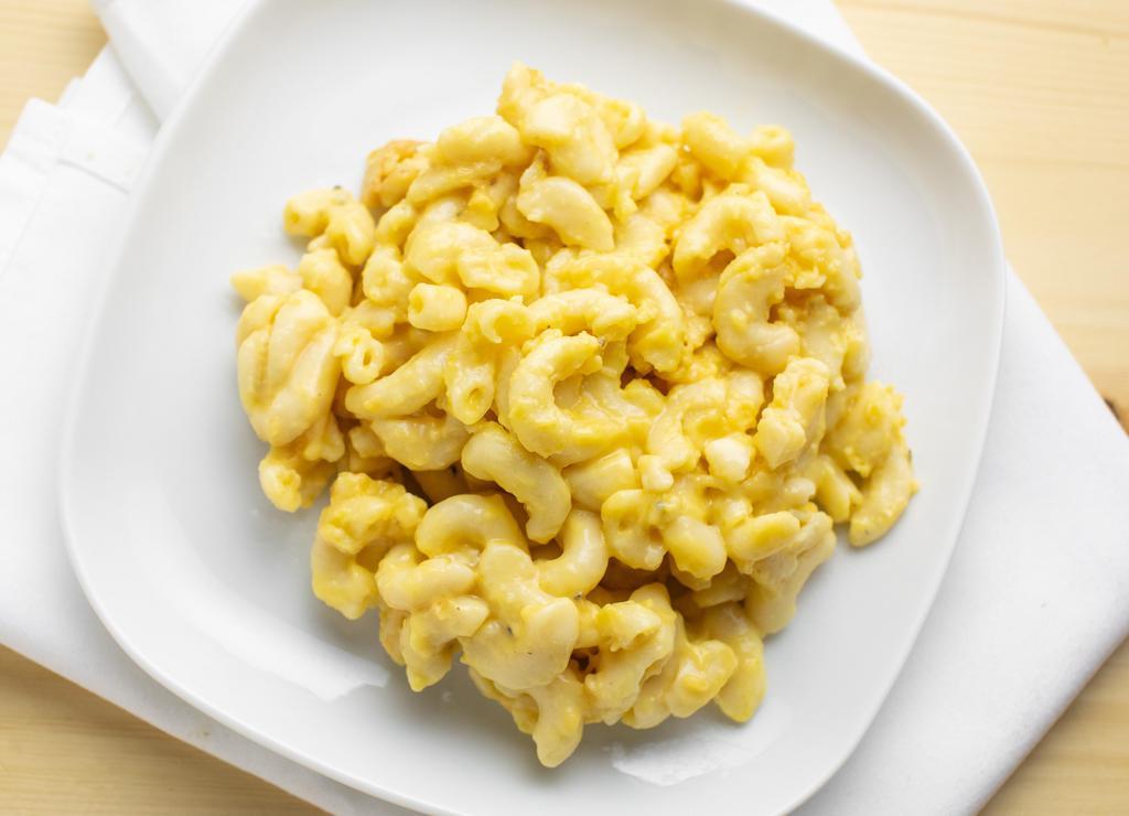 Mac & Cheese · Elbow pasta tossed in a cheddar cheese sauce, topped with cheddar cheese.