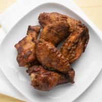 Smoked Chicken Wings · Voted best wings!. Jumbo wings dry rubbed and slow smoked, fried and tossed with your choice...