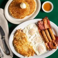 Hungry Man Breakfast · Three eggs served with three slices of bacon and three link sausages, hashbrowns and one of ...