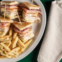 Club Sandwich · Triple decker sandwich in loaded with sliced ham, turkey, bacon, American and swiss cheese, ...