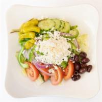 Greek Salad · Tomatoes, cucumber, onion, green pepper, pepperoncini, olives, feta, and olive oil or house ...