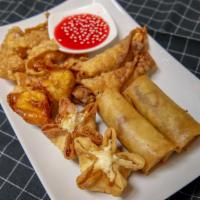 Combination Appetizer · Two shrimp rolls, two egg rolls, two crab rangoon, and two fried wonton.