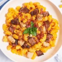 Meat Lovers Mac · Traditional mac and cheese cooked with chicken, bacon, and steak to give a rich flavorful me...