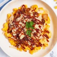 Bbq Chicken Dance Mac · Caramelized onions, BBQ cheese sauce, and roasted spicy chicken cooked with a blend of cream...