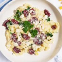 Olympus Mac · Fresh spinach, feta, Greek olives cooked in a blend of creamy white cheddar cheese and toppe...