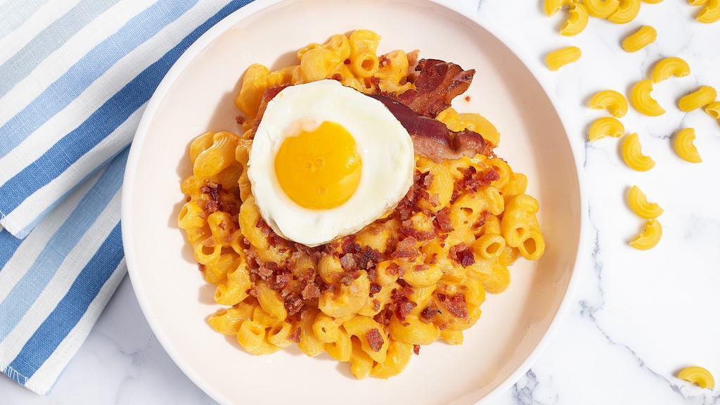 Wake Up Lucky Mac · The classic creamy mac and cheese cooked with bacon and topped with a fried egg. Add Chicken, Beef, Ham, or Shrimp for an additional cost.