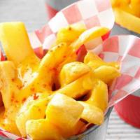 Cheese Fries · Idaho potato fries cooked until golden brown & garnished with salt, garlic, and cheese.