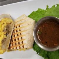 Breakfast Burrito · Tortilla with scrambled eggs and hash browns. Choice of bacon, ham, sausage, or pork chorizo...