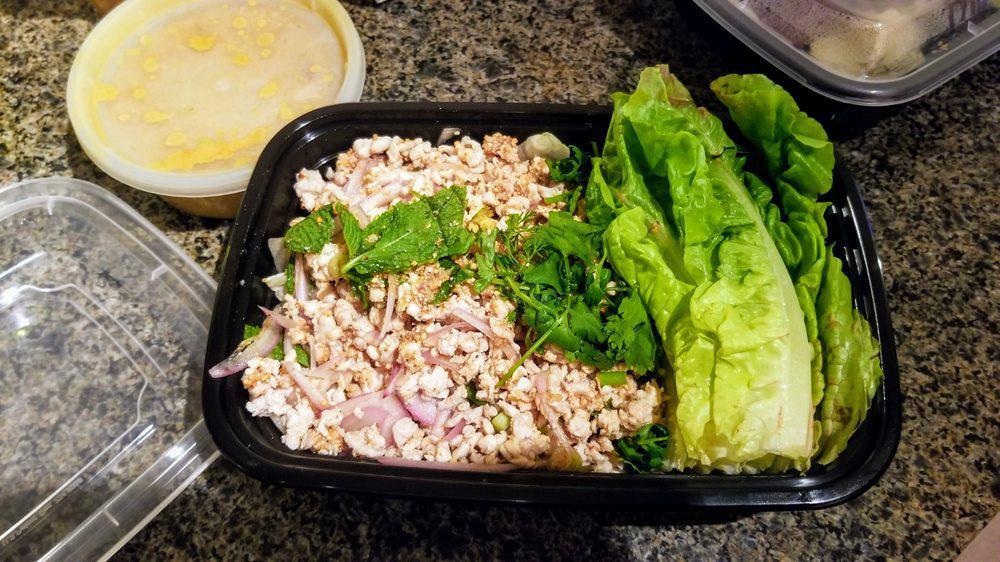 Larb Gai · Minced chicken mixed in lime juice, onions, and exotic Thai spices. Served with iceberg lettuce