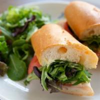 Roasted Turkey And Swiss
 · Tomatoes, mixed greens, mayo and mustard on baguette.