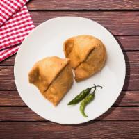 Samosa Junction · Savory deep fried pastry puffs filled with mildly spiced potato and peas.