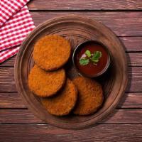 Famous Aloo Tikki · Grilled Indian spiced potato patty served cold with yogurt and tamarind chutney.