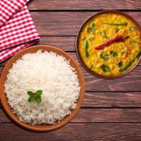 Dal Tadka Rice Bowl · Yellow lentils tempered with garlic, ginger, onions and spices. Vegan with aromatic basmati ...