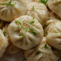 Pork Pan Fried Dumplings · Our most popular menu item! Fresh pork filling