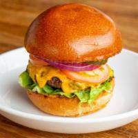 Bevvy Burger · Beef patty, american cheese, tomato, arugula, onions, pickles, red relish, and buttermilk bun.