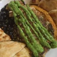 Muscle Bowl · Quinoa, black beans, red pepper hummus, pico, grilled pita, and cilantro lime crema. Vegetar...