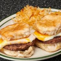 Anthony Quinn · 2 jalapeno cheddar biscuits with chorizo patties, cheddar cheese, topped with fried eggs & s...