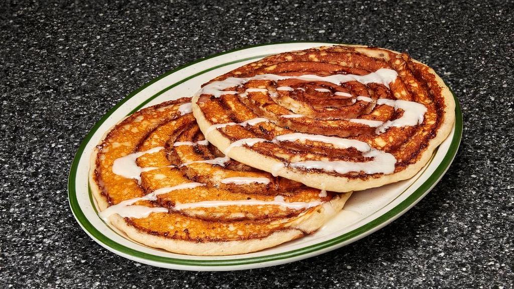 Cinnamon Roll Pancakes · 2 hotcakes with cinnamon roll center, topped with cream cheese icing