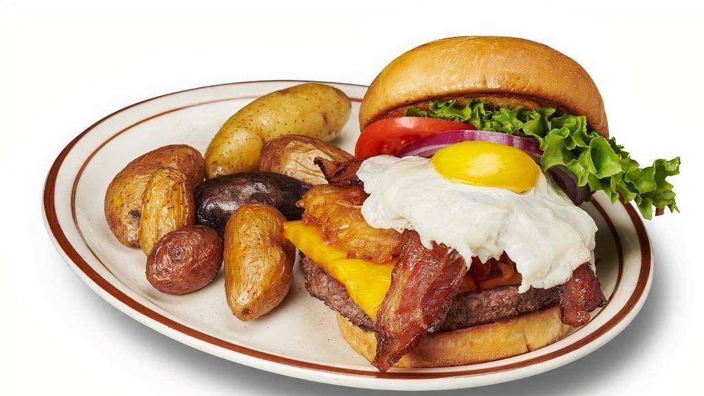 Ernest Hemingway · smoked cheddar, bacon slics, fried hash brown cake, lettuce, tomato, red onion & a sunny-side up egg