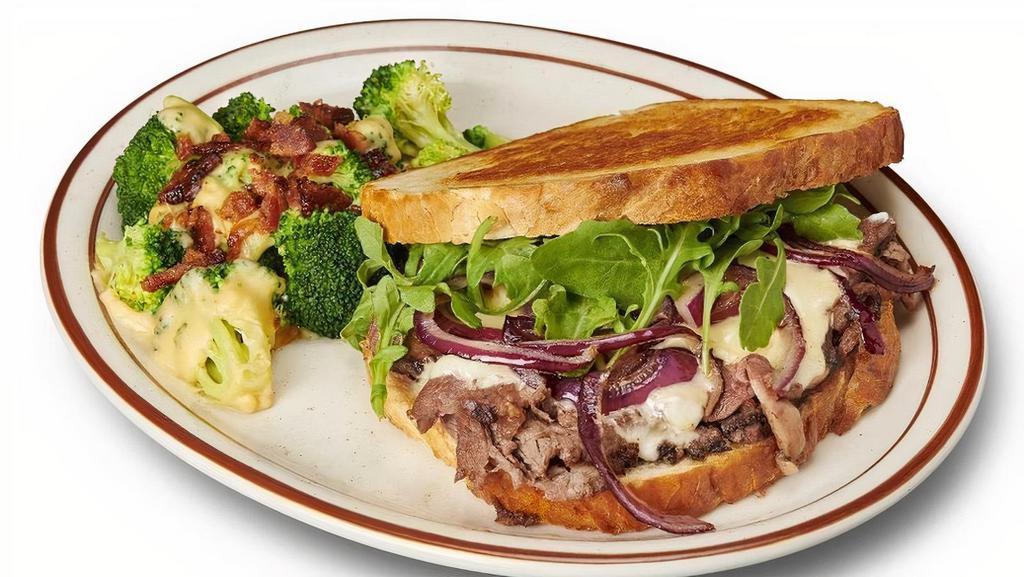 Jackie Gleason · sourdough bread, grilled red onions, arugula, thin-sliced prime rib, swiss cheese & spicy horseradish cream served with au jus for dipping