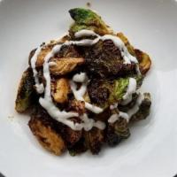 Crispy Brussels Sprouts · with Nuac Cham & Ginger Dill Yogurt. Gluten Friendly- Brussels Sprouts share fryer