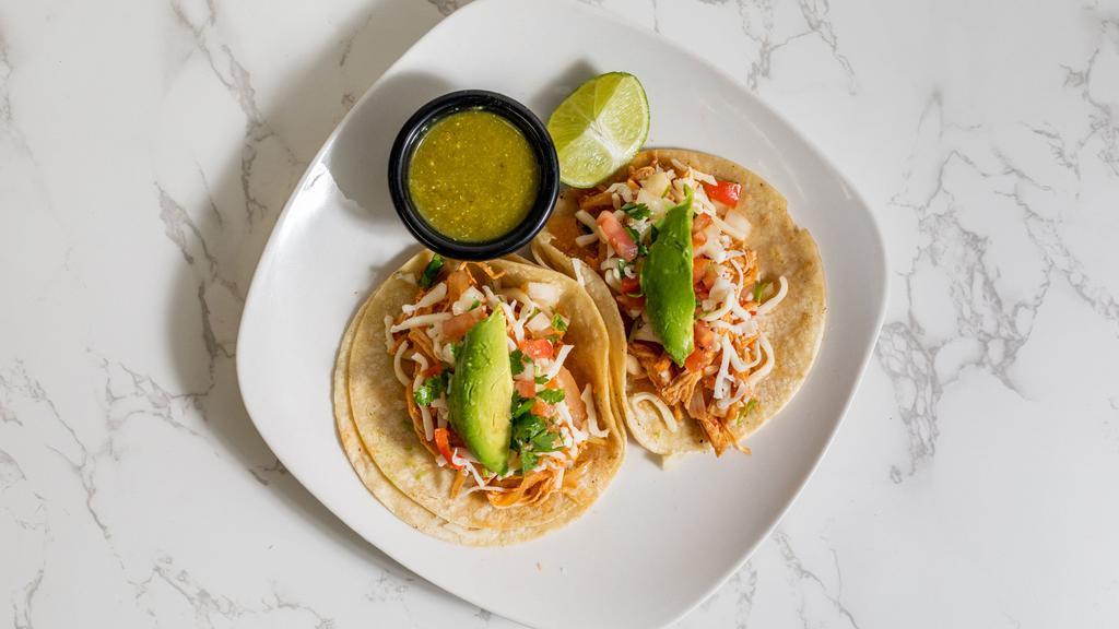 Regular Tacos · Includes 2 corn tortillas, onions, cilantro, and salsa.