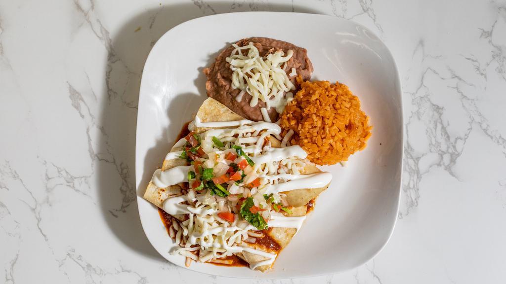 Enchiladas · Layered corn tortillas, green sauce, white cheese, and sour cream.