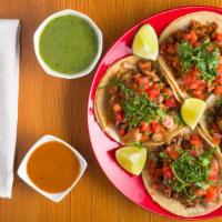 Tacos · Corn tortillas, your choice of carne meat topped with pico de gallo cilantro.