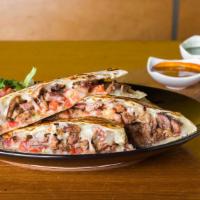 Quesadilla · Large flour tortilla filled with your choice of meat, cheese, and pico de gallo.