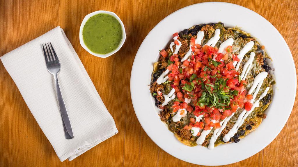 El Capitan Nachos · Fresh tortilla chips smothered with cheese, black beans, the meat of your choice, salsa, pico de gallo, cilantro, sour cream, and jalapeños.