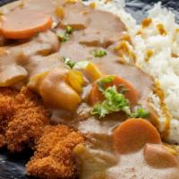 Katsu Curry · Deep fried breaded pork cutlet with curry sauce on the rice.