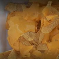 Nachos · Corn Tortilla Chips with Nacho Cheese & Jalapenos