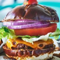 Veggy Cheeseburger​ · Beyond meat plant-based patty, hydroponically grown butter lettuce, tomato, red onions on a ...