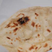 Naan · A piece of heaven!! A fresh baked to order fluffy flat bread made from fine leavened flour a...