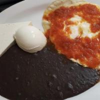 Huevos Rancheros · Three over-easy eggs. It comes with a corn tortilla in the bottom with ranchera sauce on top...