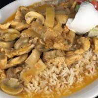 Arroz Con Pollo · Chicken breast, mushrooms, onions, cooked with special salsa, rice, sour cream and salad. se...