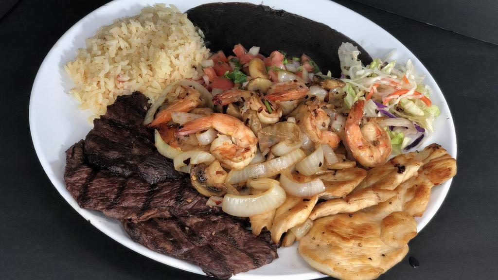 3 Amigos Plate · Eight ounces. carne asada, eight ounce pollo asado, one prawns order. Mojo de ajo style, or a la diabla style cooked with onions and mushrooms. Served with rice, beans, salad and warm tortillas