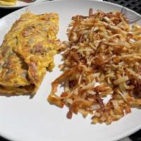 The Whole Hog · Bacon, sausage, ham, and cheddar cheese. Served with choice of breakfast potatoes or hash br...